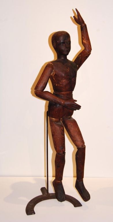 This is a rare, large articulated artist figure with fine detailing to the face, hands, feet and chest. Notably, the figure remains mounted on its original iron base stamped with manufacturer's name: F. Weber & Co. Phila (see photo). The company was