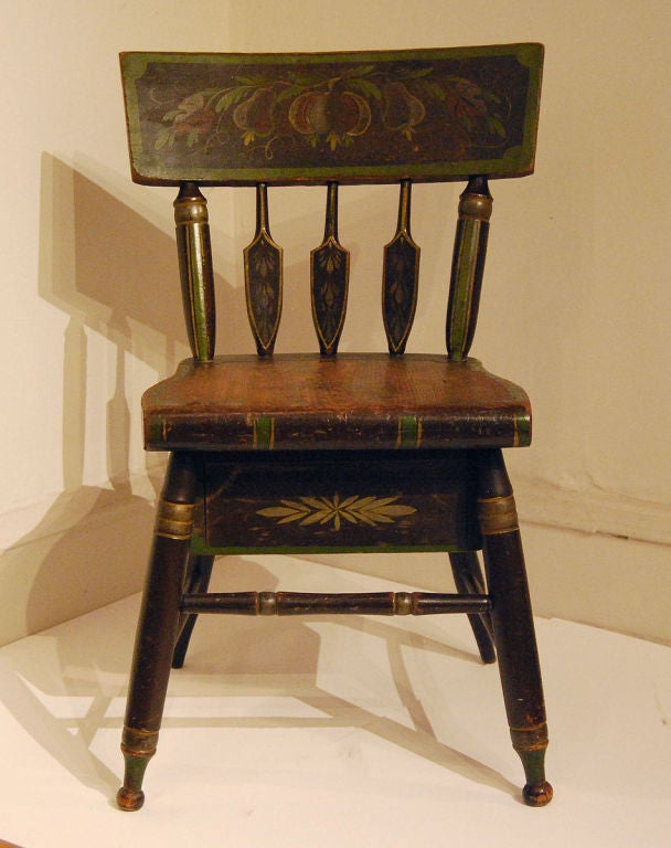 Excellent, rare lady's sewing or work chair with a drawer that pulls out to the side, with original iron lock. All original paint with great color and contrast (pears, apple, vines and tendrils), nice arrow-back spindles and good turned legs.