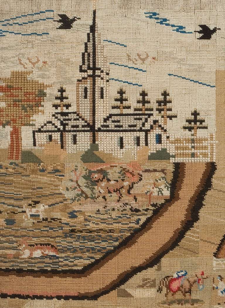 This splendid, fully worked landscape portrays a lively pastoral setting with many buildings, people and farm animals; while needlework pictures of this type had been made for over a century at this point, favored by both American and English young