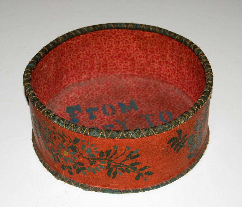 Charming basket with a flower motif painted around the outside, the bottom and inside is lined with fabric and stenciled: 