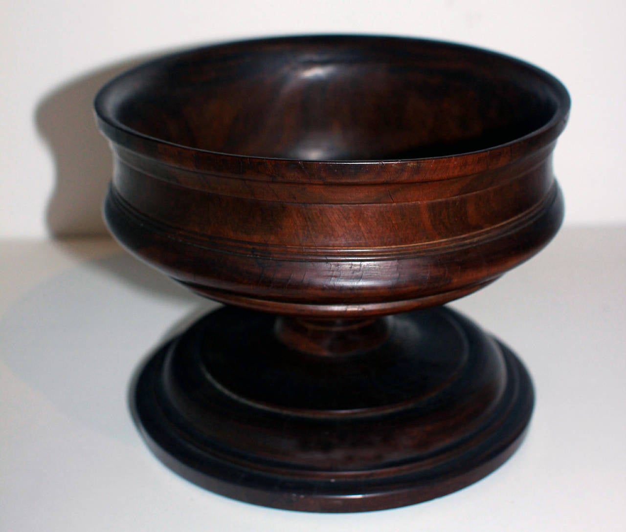 Handsome, heavy compote made of turned lignum vitae - a dark, strong and dense wood. Early 19th century, wonderful rich color and patina.