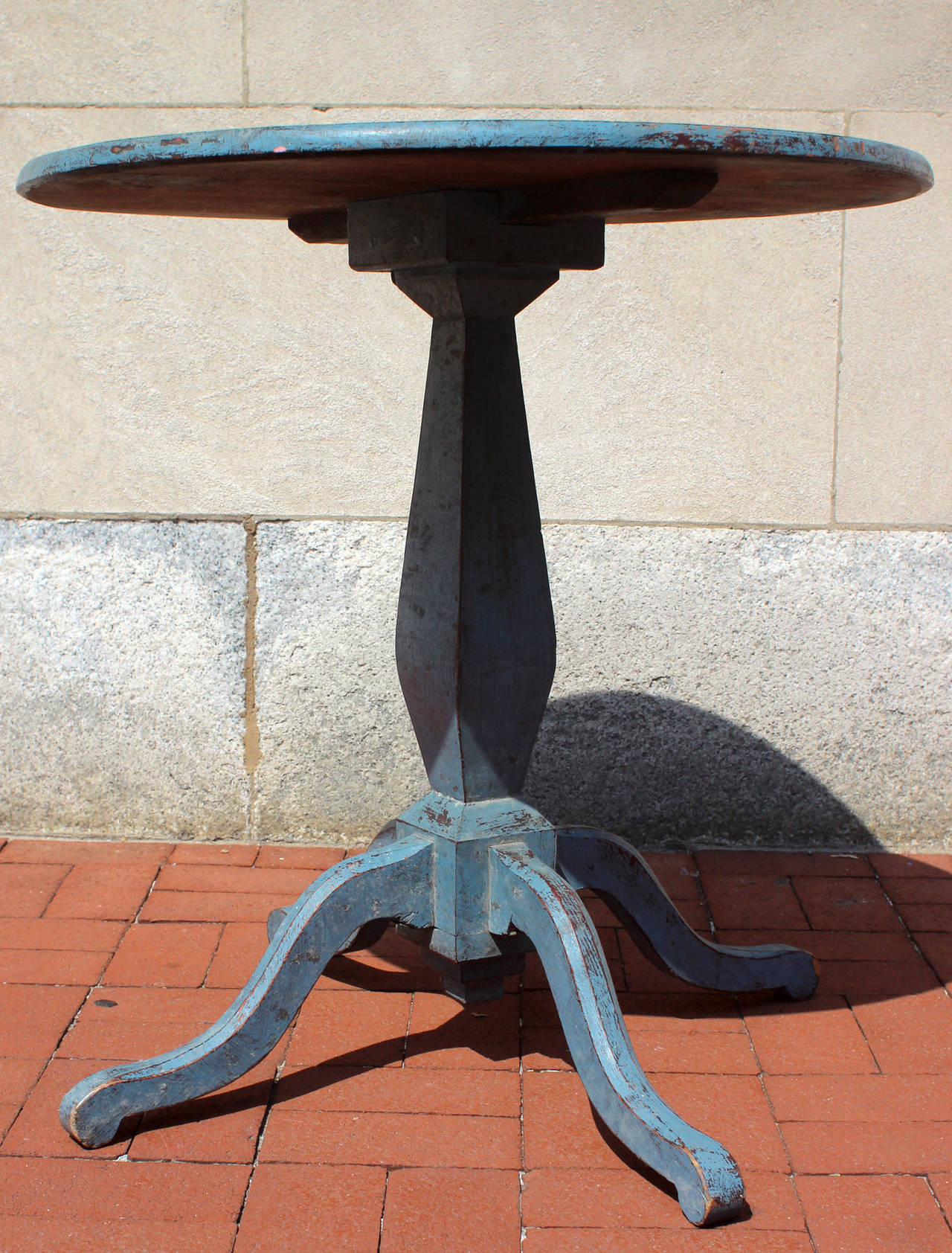 Excellent pedestal center table in original blue paint. Very good proportions, chamfered edges to the four legs and slight scroll to the feet. Crisp lines, battened top; American, circa 1880.