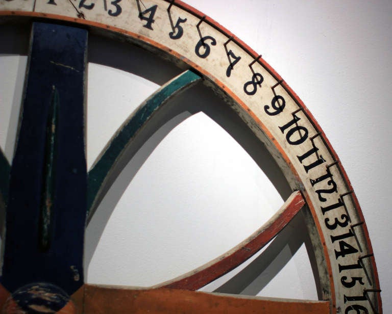 Very handsome and large painted carnival game wheel, four colors and numbered 1-60; all original. American, early 20th century.