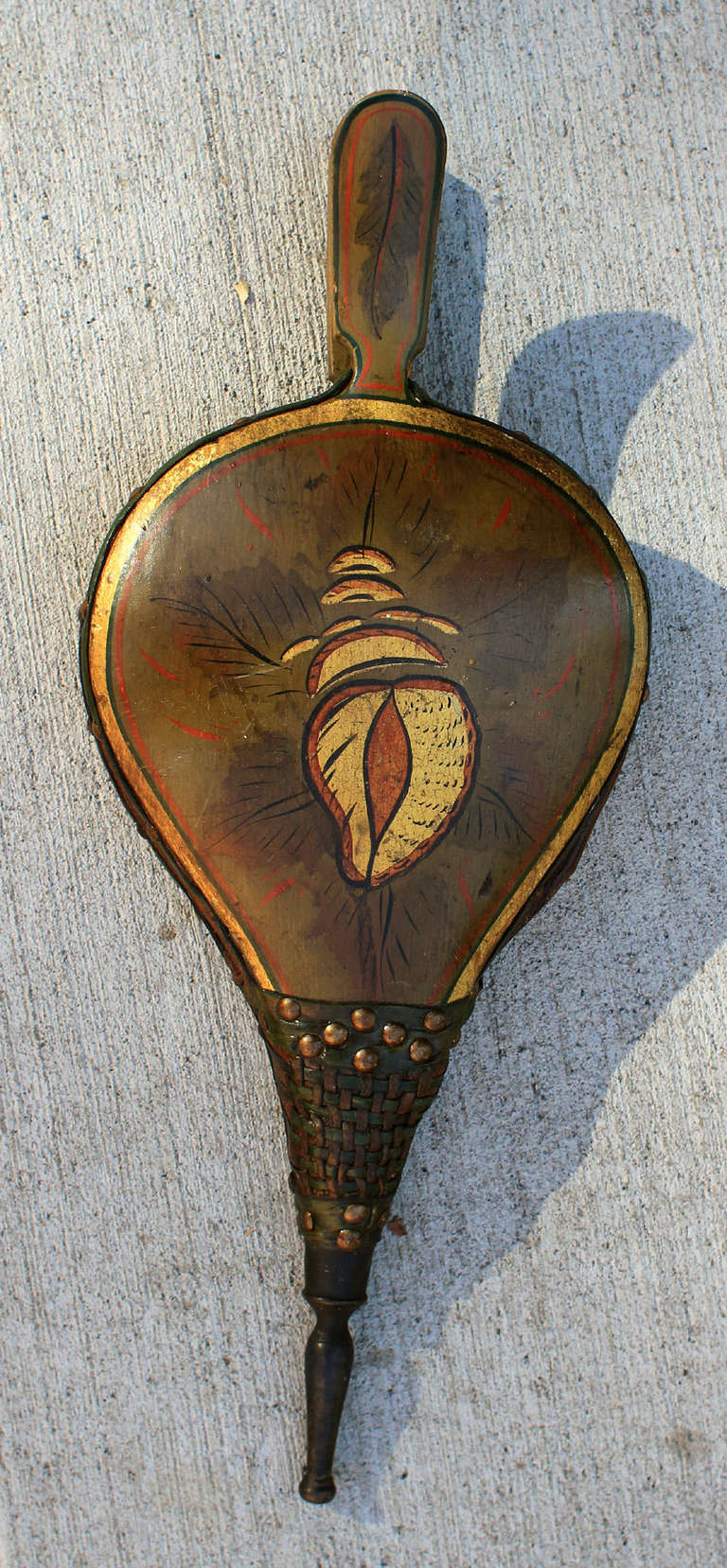 American folk painted turtleback bellows with all original paint and gold shell and leaf decoration and a gold and red line border, nicely contrasted on a deep ochre field; leather and mechanics have been restored and its now in good working