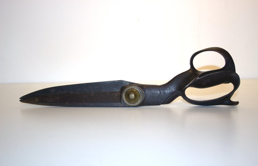 Very large and well-made steel tailoring scissors with the maker's patent encircling the brass adjusting bolt, which reads: 