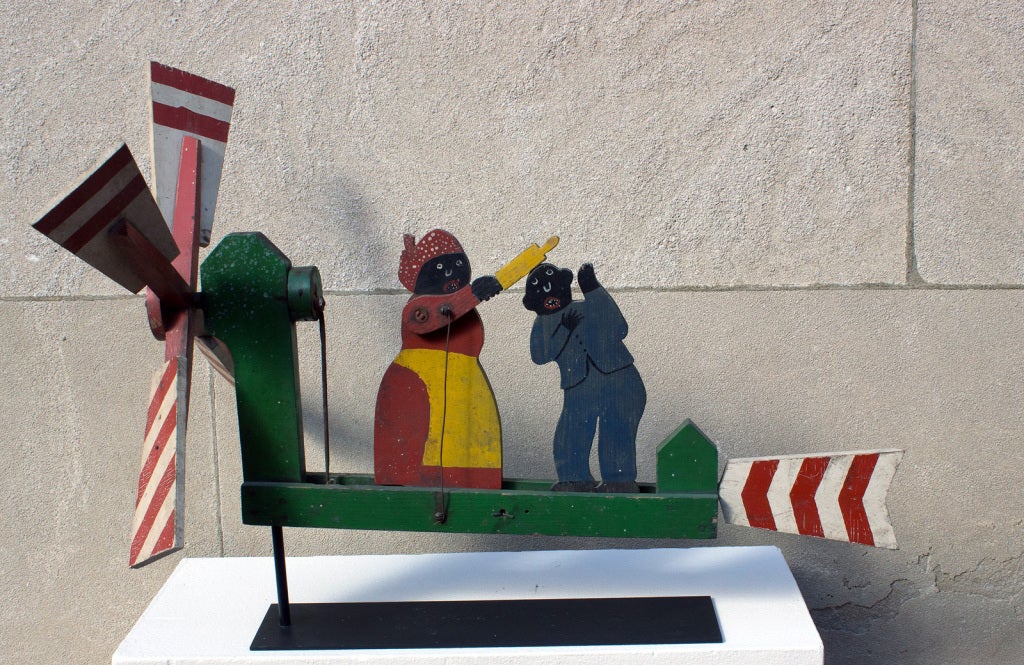 A fine example of Black American folk art, this whirligig is in full working order: as the wind blows and the blades spin, the woman hits the man over the head with a rolling pin. Great facial expressions. Early 20th century, American. All original,