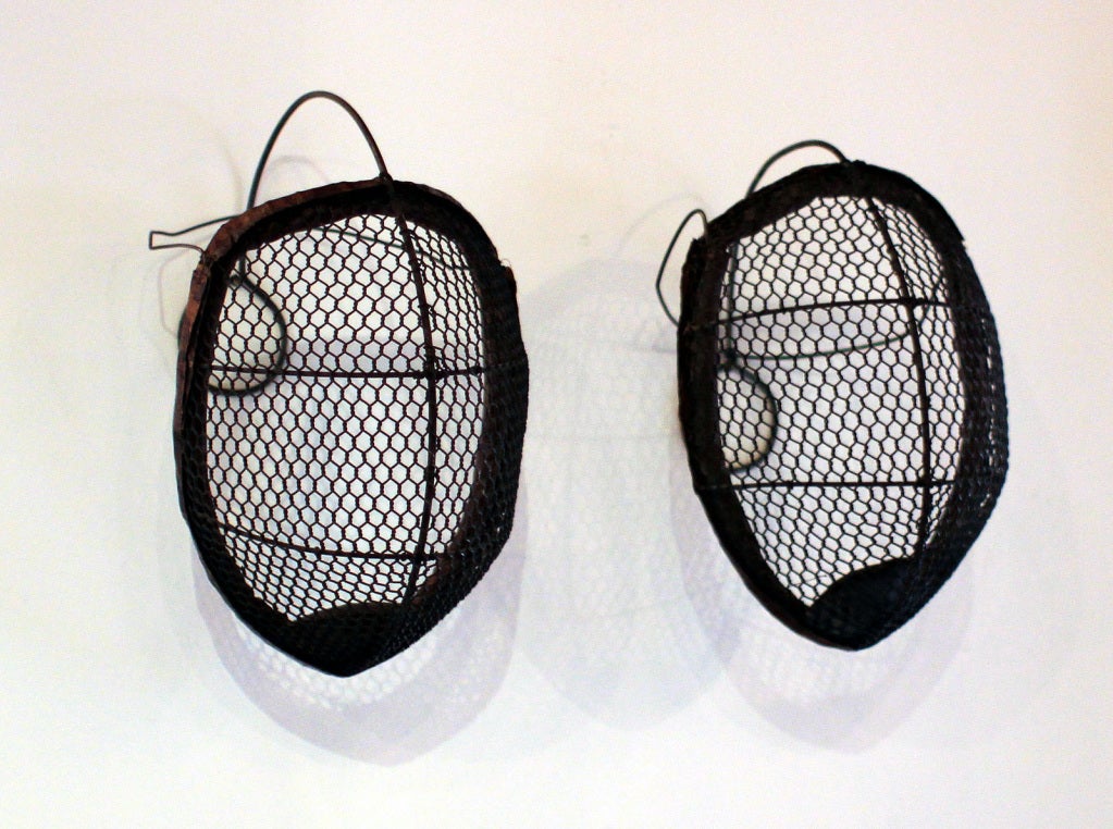 Striking pair of early 20th century facing masks.