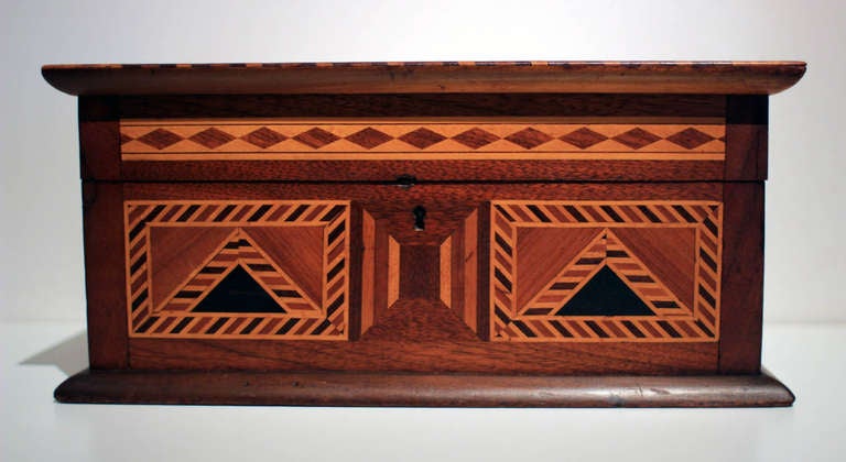 Excellent jewelry box with removable tray, outstanding marquetry of stars on top and geometric patterns on all four sides, mixed wood. Probably American, mid-19th century.