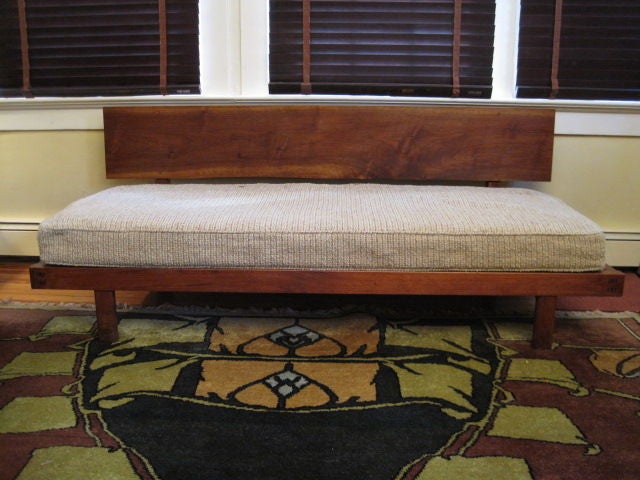A sofa, daybed, bench, this piece has been called all three.<br />
It is one of a very few forms by Nakashima that can be called a sofa. It has a spring and foam inner cushion that makes this form very comfortable. this large cushion is original to
