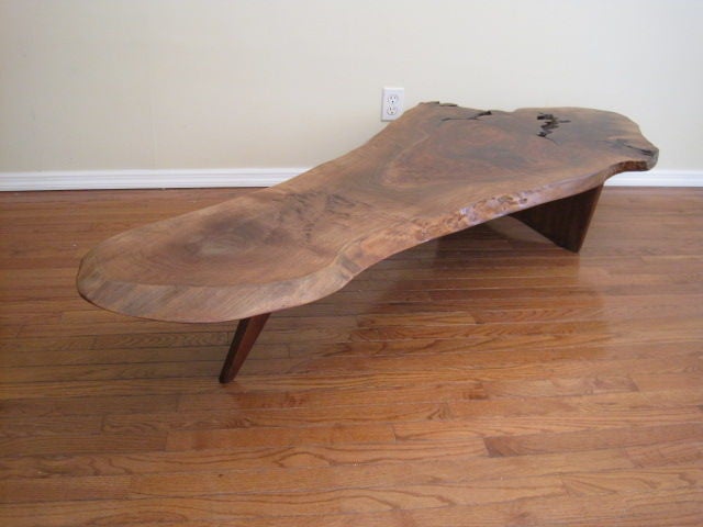 A massive Slab of well choosen Walnut was used to create this table. One of the most interesting tops I have offered to date.<br />
Very deep fissures and marble swirling to this top give the table great depth.Large butterfly and heartwood center