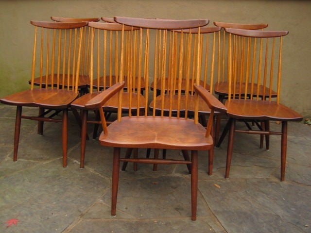 A beautiful set of ten Walnut dinning chairs. This set has a beautiful aged and very even patina. The Hickory spindles have turned to a golden tint. These are the best example of this form that I had so far to date.