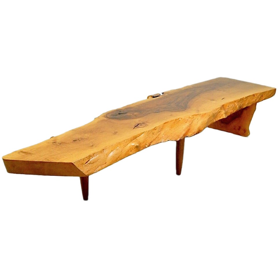 An English walnut coffee table by George Nakashima For Sale
