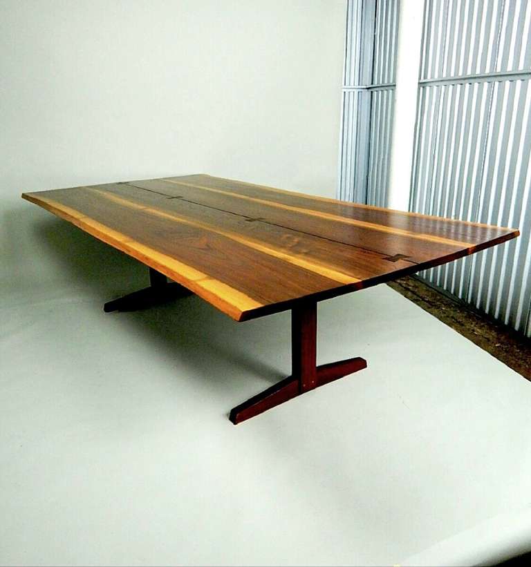 A massive Walnut top having great sapping to boards and great free edge. This top is thicker than most tables of this length. Supported by the classic trestle base.