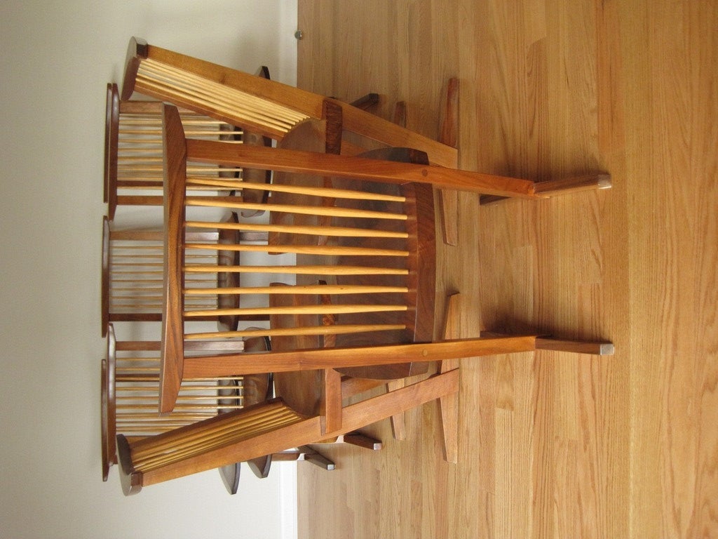 A great set of eight chairs made of Walnut with Hickory spindles.Shoe feet supporting canted Walnut legs.
A beautiful selection of Walnut boards used in the seats. This set was well cared for and is in excellent original condition. Each chair is