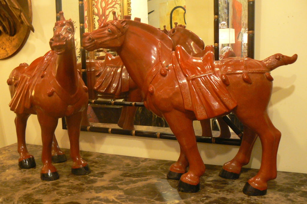 Delightful pair of 1940-50's dark red horses with hand-carved features and very detailed etched gilded pattern.