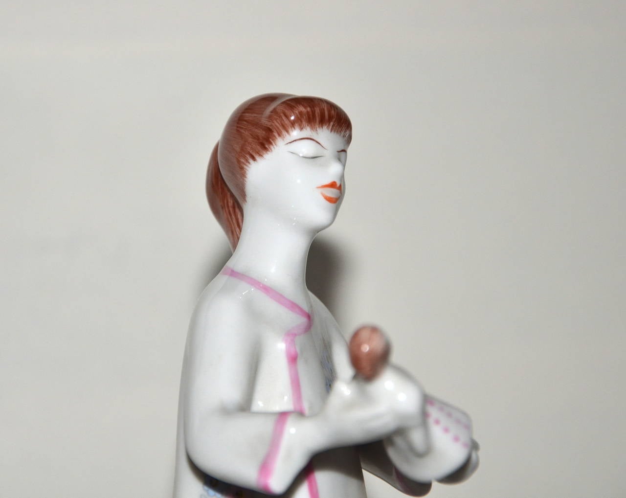 Mid-Century Modern ceramic sculpture, girl with doll, hand-painted ceramic, 1950s.