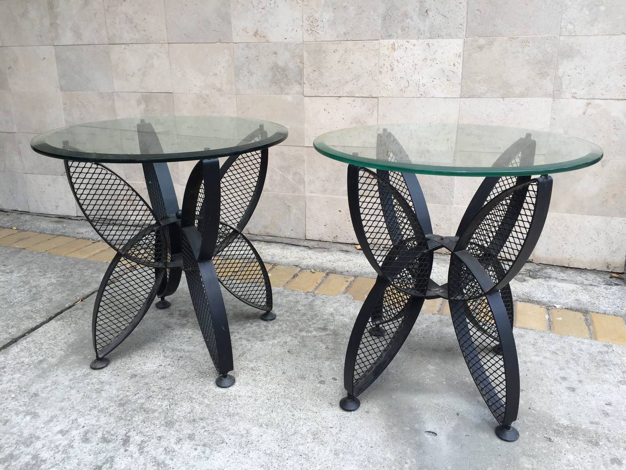 Massive French mid-century modern wrought iron pair of side tables with glass top