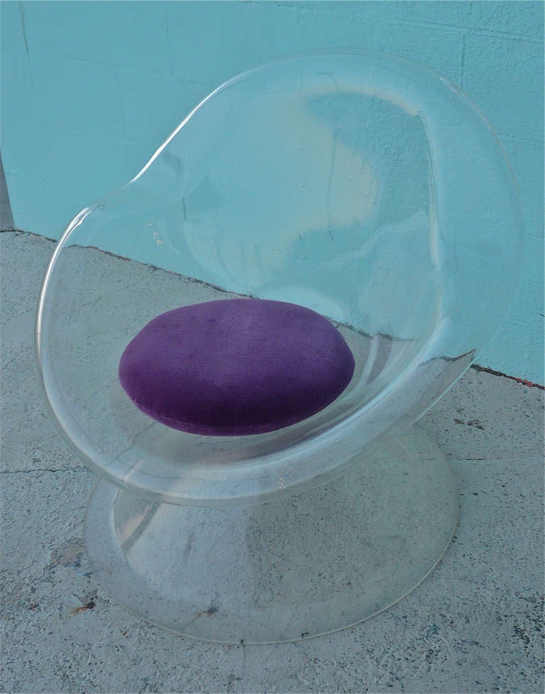 Designed by Laverne International using molded acrylic with a purple velvet cushion.