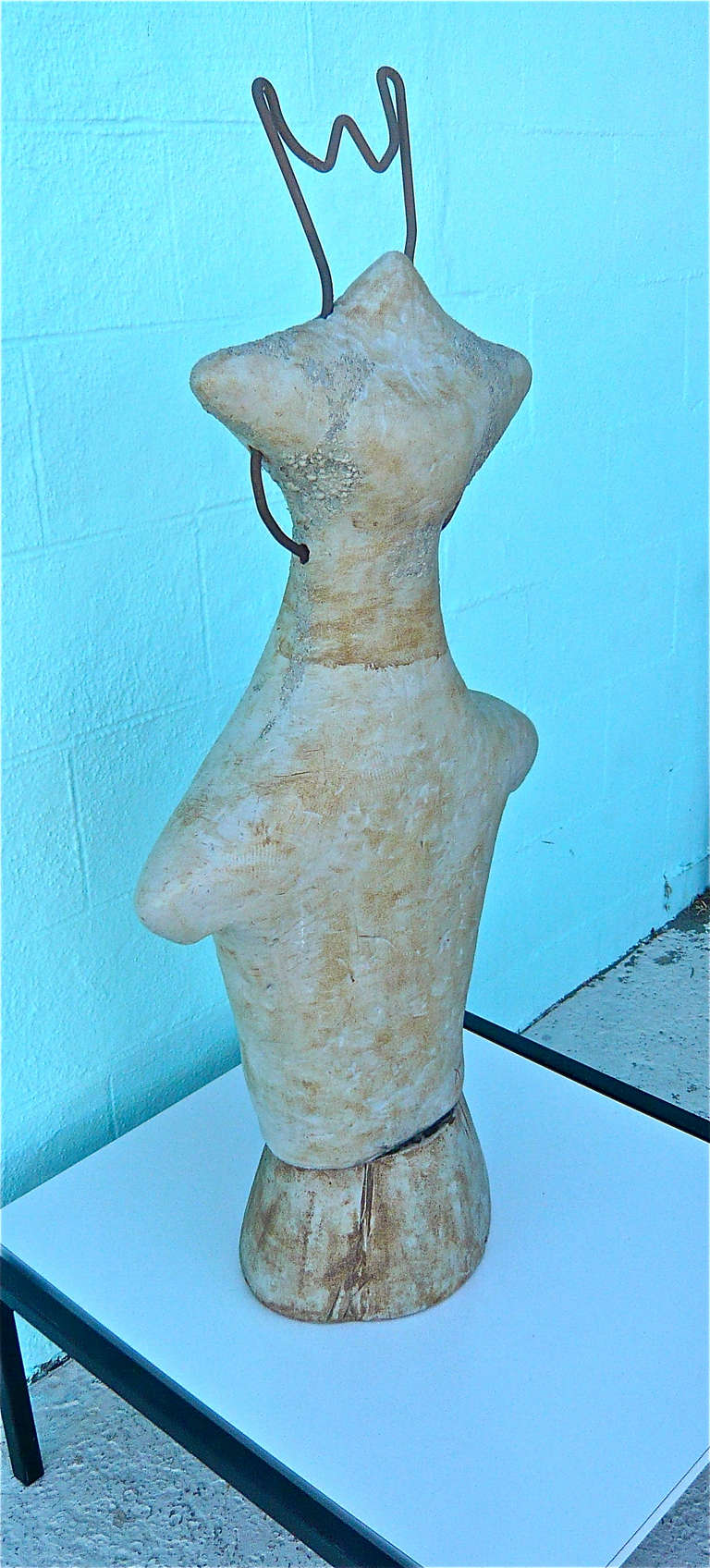 Ceramic and metal freeform sculptural bust,  slightly alien in nature.
Mottled glaze,unreadable incised signature.