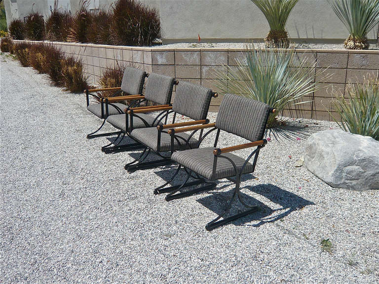 Designed for the Terra Furniture Co.,these chairs are for indoor or outdoor use.Newly upholstered in Sunbrella fabric on black painted metal frames with oak dowel armrests.
Seat height - 16