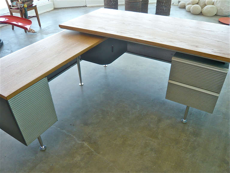Designed by Welton Becket for executives of the Kaiser Aluminum Co. headquartered on Lake Merritt in Oakland in 1957 .The building was designed by Becket who also did the iconic Capitol Records Bldg. in Los Angeles,Ca.The desk along with the return