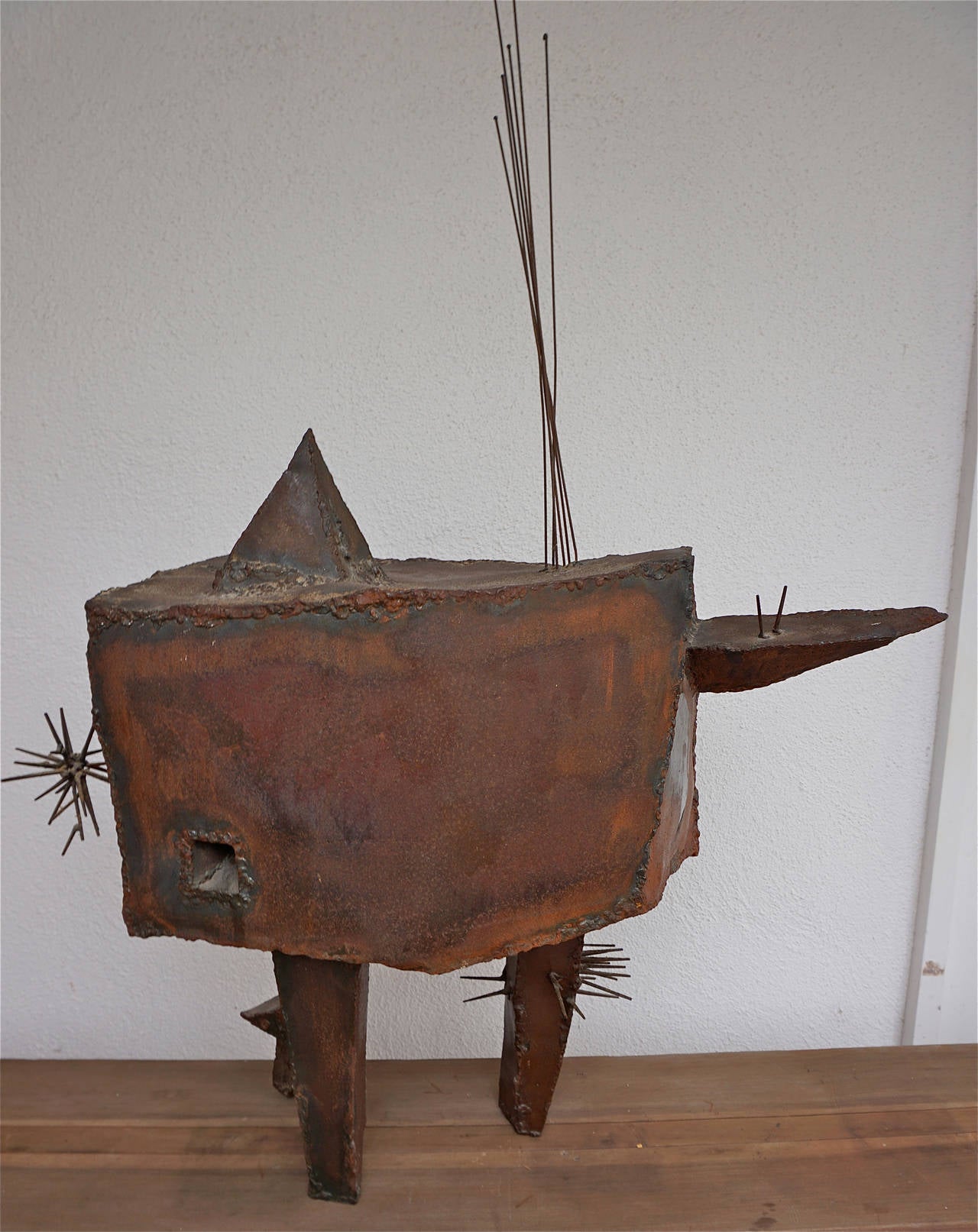 Welded, oxidized steel transformed into a very unusual sculpture.
Unsigned.