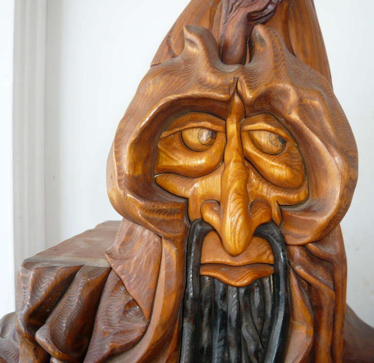 Wizard or warlock?Jewelry or stash box?Unique,time staking craftsmanship executed with  a lot of talent and a great sense of humor.Opening the door reveals a series of pullout drawers and doors that open up with different designs carved into the