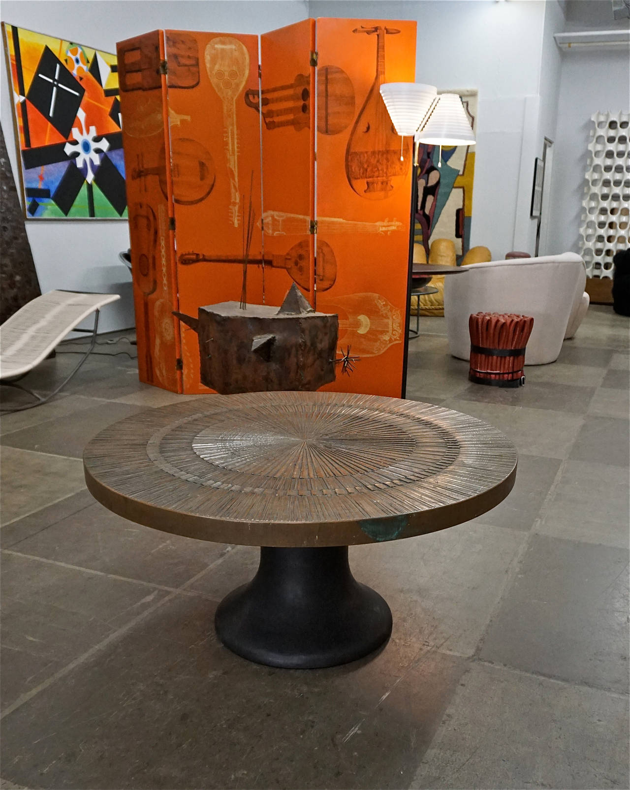 Designed in the 60's by Billy Joe McCarroll and David Gillespie for Forms&Surfaces,Santa Barbara Ca. Bronze resin table top on a black painted steel base.