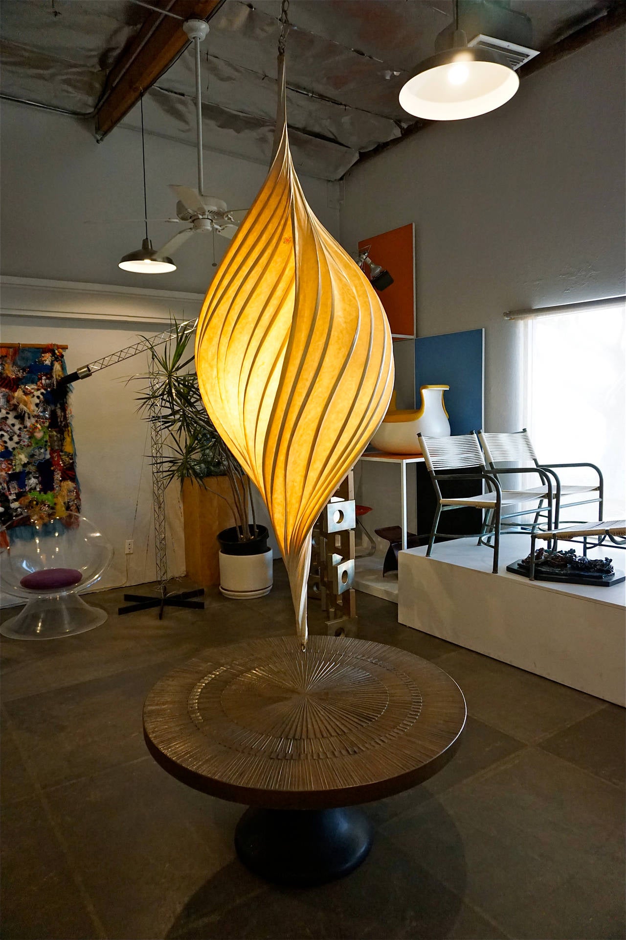 Measuring a full 6 ft. tall, Stephen White creates these one off light sculptures using bentwood and a papier mâché technique using rice paper.