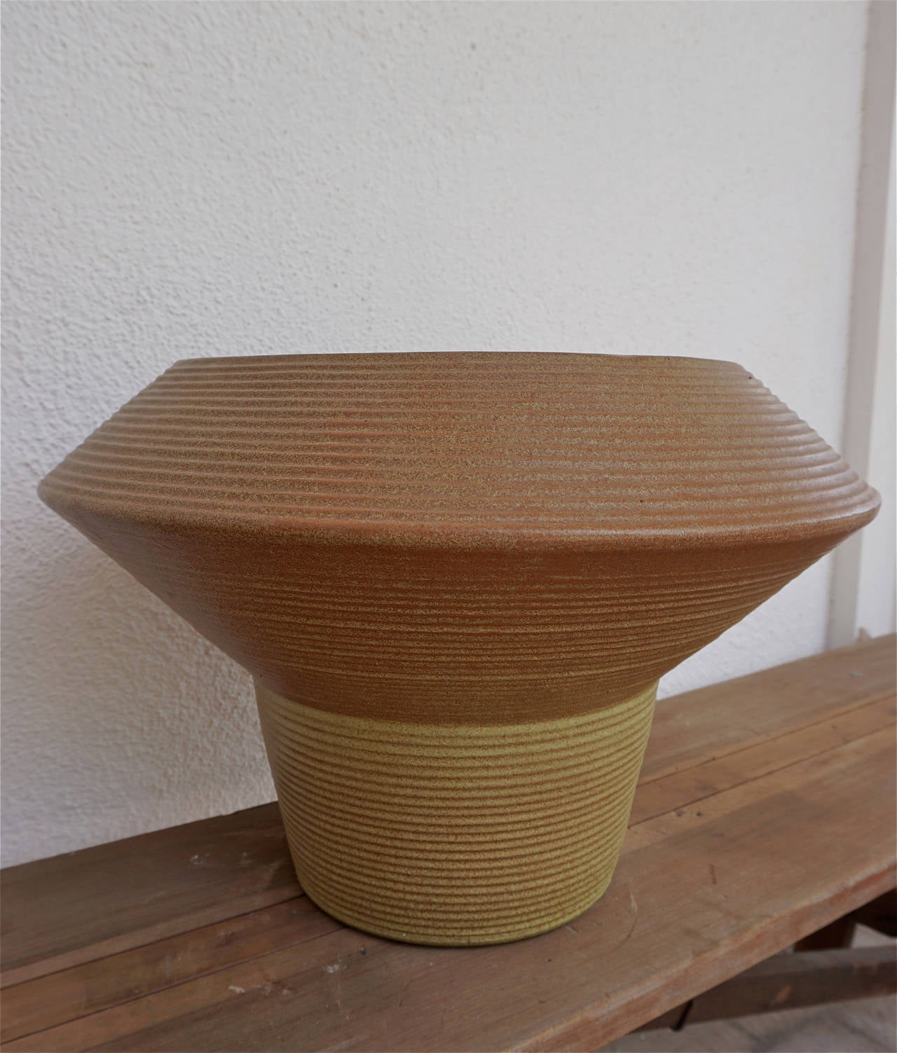 Striking example of Mid-Century pottery, ribbed and two-toned in earthy colors.