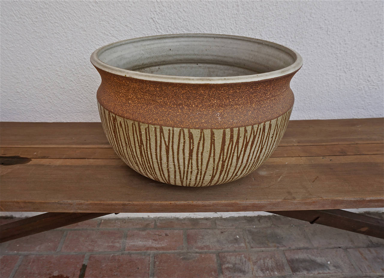 Hand thrown and drip glazed, nice earthy tones, for indoor or outdoor use. Unsigned.