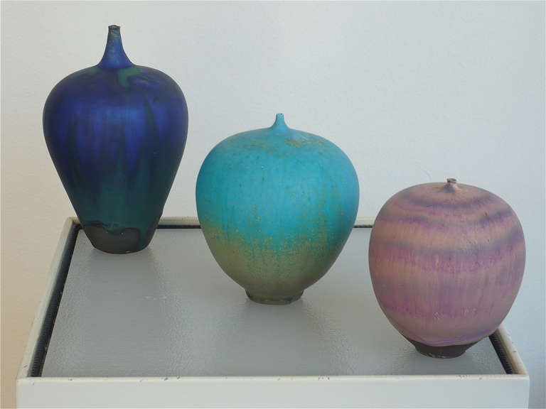 Group of 3.
These bulbous little vases with their colorful drip glazes and diminutive flared necks are the signature pieces of the master studio potter Rose Cabat . 