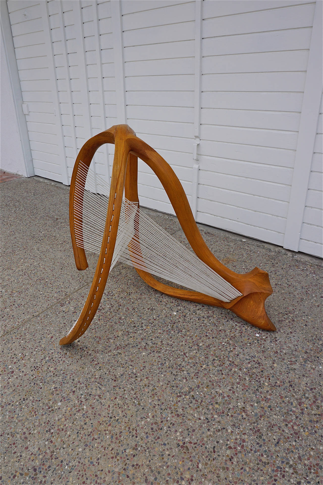 Unique sculpture made from solid pieces of oak, carved and joined, with string added to create an optical effect.
Unsigned.