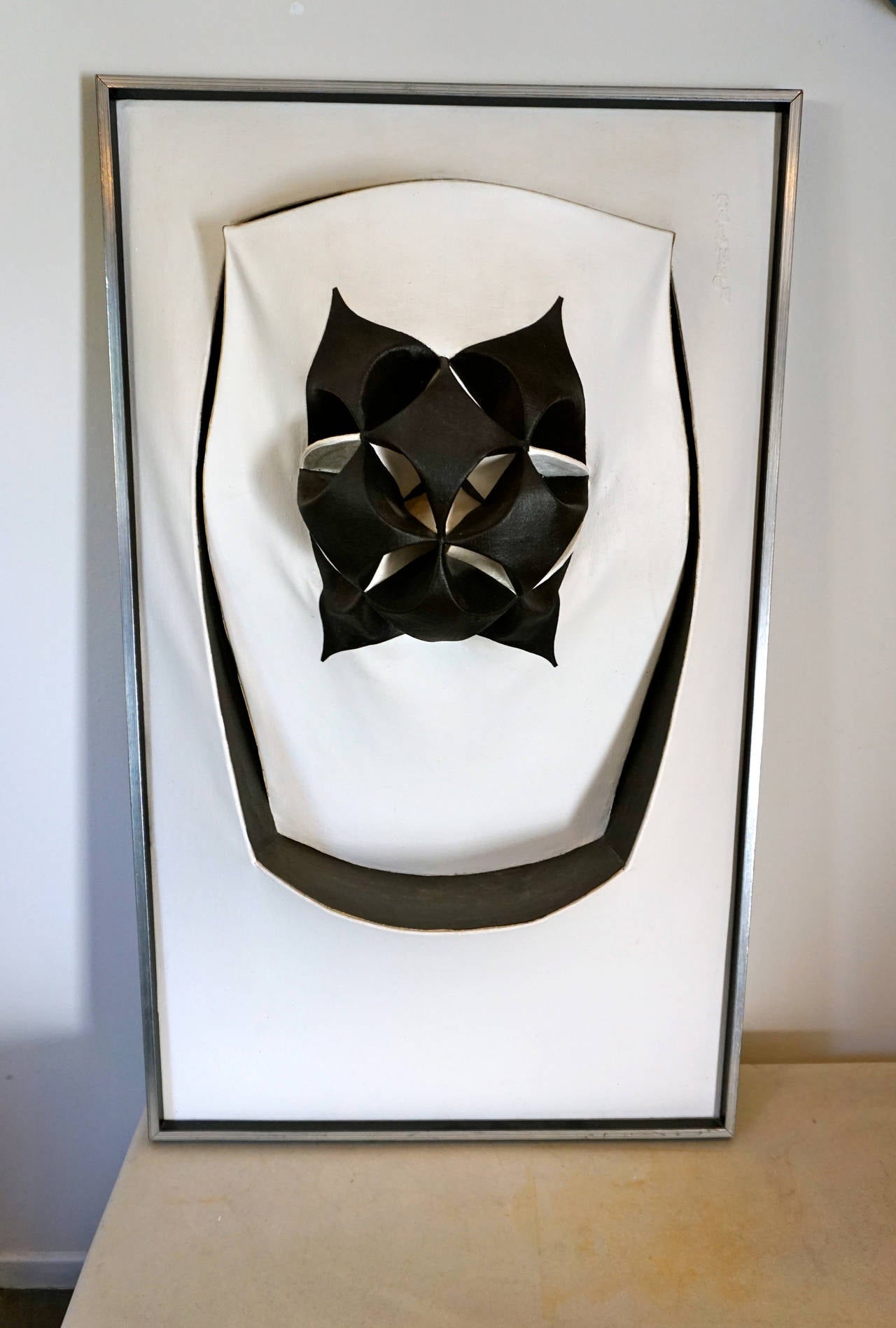 Black and white three-dimensional painting titled "Oracle". Signed "Zellinger" in relief and dated 1976 from the visual arts exhibit in Ontario, Canada.