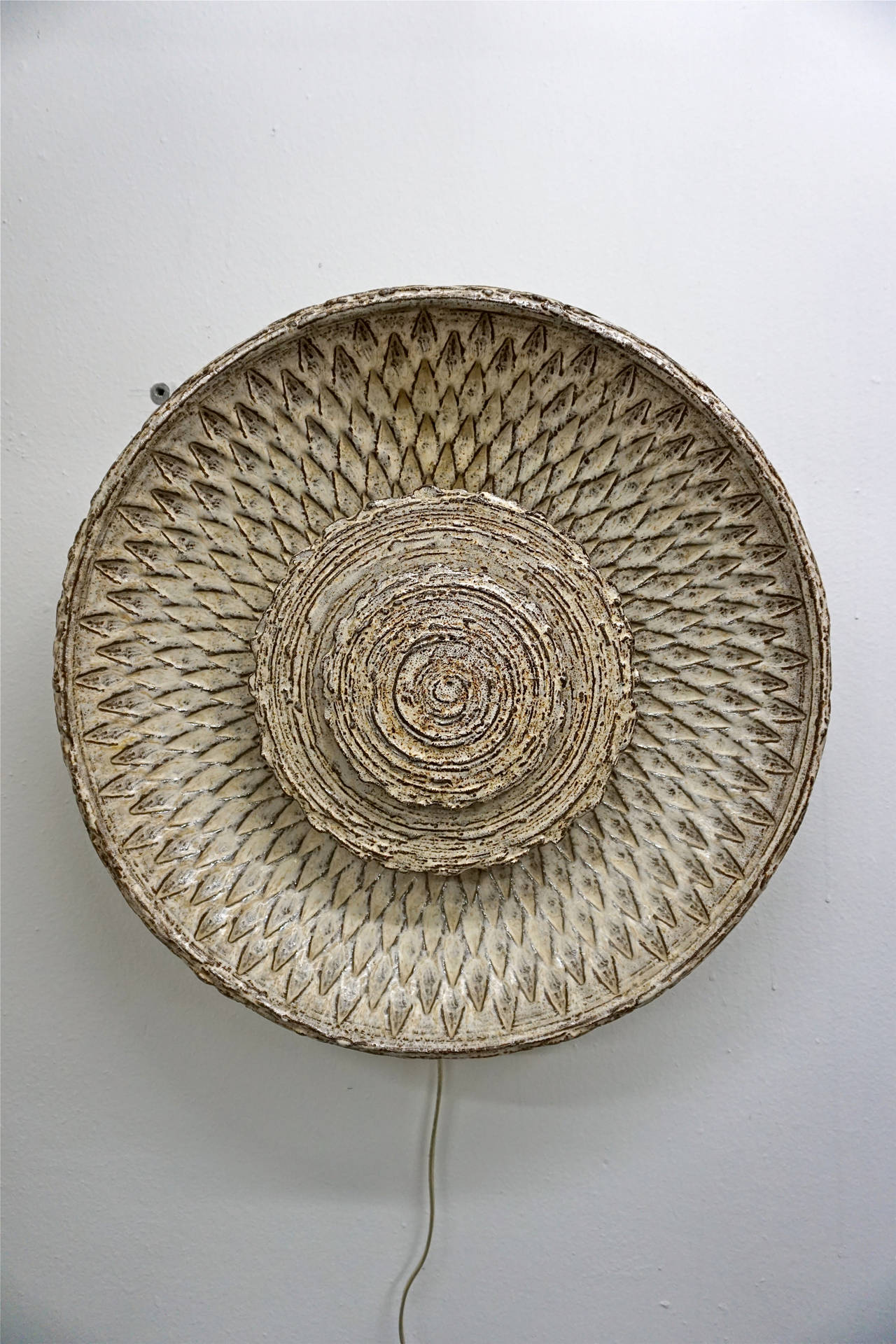 Unusual and dramatic lighting. When not lit it is a beautiful piece of 1960s Scandinavian pottery.