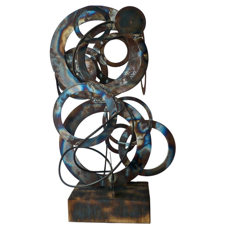 WELDED STEEL DISC SCUPLTURE BY FRANK COTA