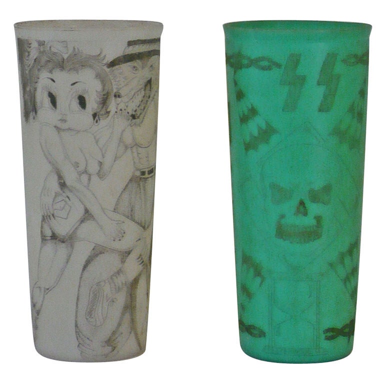 PRISONERS USE PINS AND MOISTENED CIGARETTE ASH TO MAKE THESE INTRICATE DESIGNS ON TUPPERWARE PLASTIC CUPS.HIGHLY DETAILED AND TIME CONSUMING.