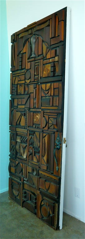 Using found objects and scrap wood from her husbands woodworking shop, along with inspiration from Louise Nevelson,she created this assemblage that functioned as a door.These panels have also been wall mounted as works of art.
