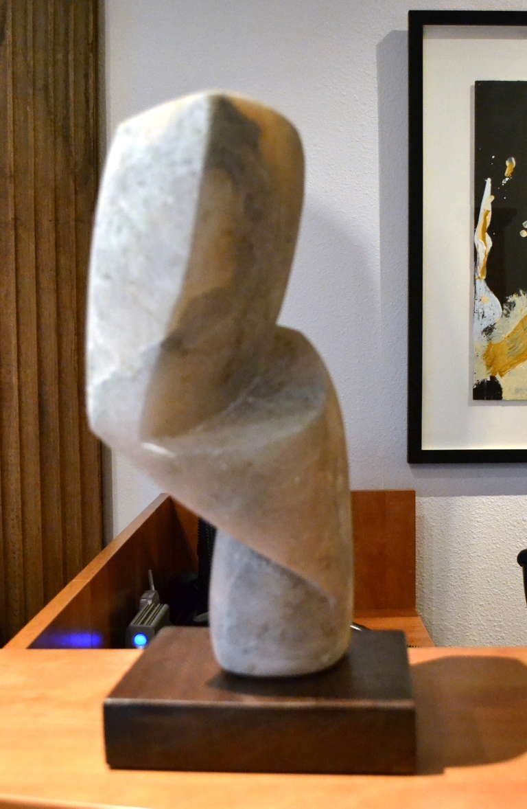 California artist, Scott Donadio (b. 1961) hand carved this abstract form out of alabaster and titled it  BRANCUSI ON TUESDAY.  The stone has interesting coloration and veining running throughout, adding movement to the simple lines that have been