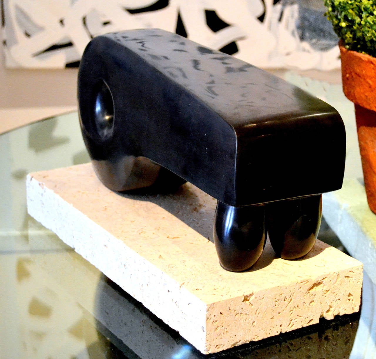 One might instantly assume Henry Moore or Brancusi, but instead this beautiful abstract sculpture is by highly collected California artist Scott Donadio (b. 1961). Carved from a single block of Belgium black marble, this sculpture will make a strong