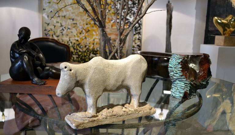 This stone cow was apparently cast in France in the 1920s, in a traditional manner. It looks great simply sitting on a farm table or even outside in the garden or use as a door stop.