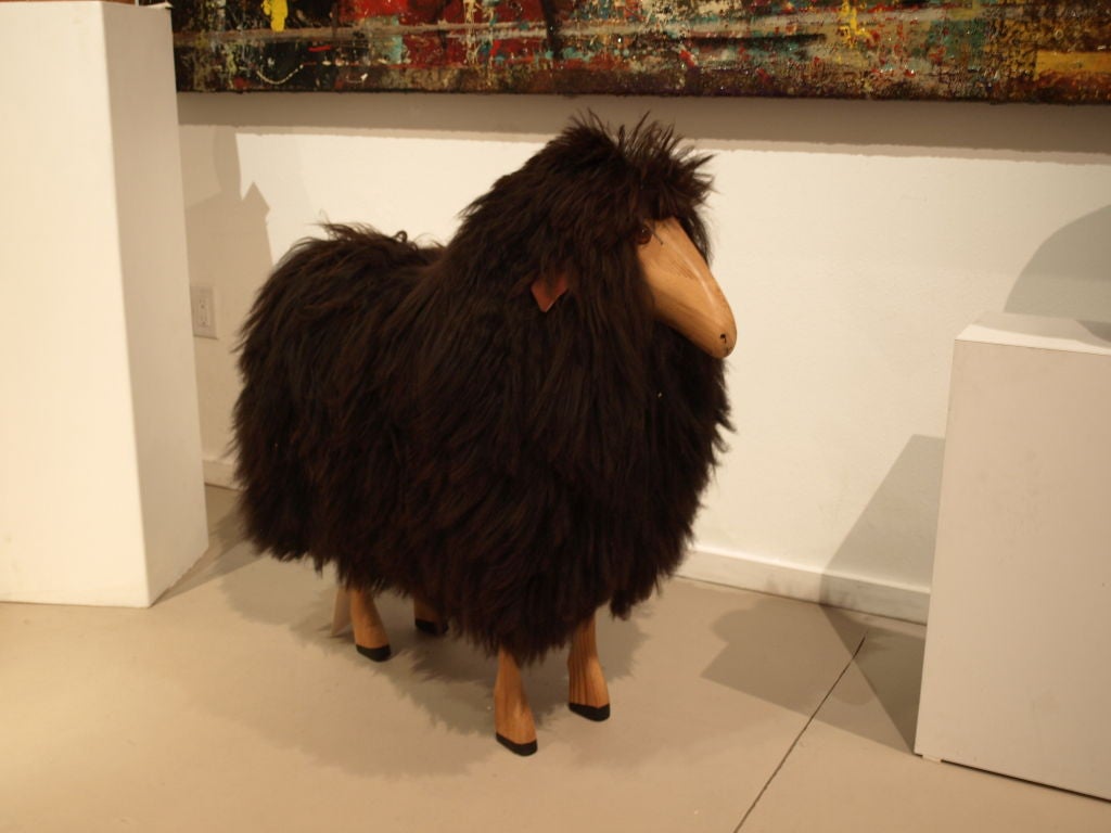 A fine example of the Francois Xavier Lalanne sheep sculpture, except this one is made of pine and has a Flokati skin in choclate brown.<br />
<br />
It's unquestionably a show-stopper, grazing around your home or office.