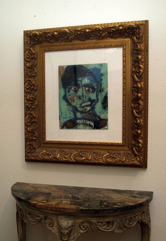 An abstract self-portrait of the artist “Cyrstofer” aka Christopher Shoemaker, (b. 1969)  in mixed media under glass.  The signature is painted as part of the artist’s collar.  A heavy molded gold leaf frame makes this painting serious business for