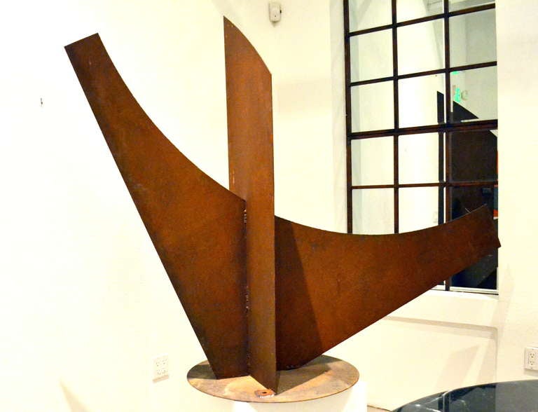 The artist Simi Dabah (b. 1927), a CA abstract sculptor who works with Industrial reclaimed steel by assembling it in such a manner that it is pleasing to eye and in balance. A perfect example shown here.

This large outdoor abstract sculpture