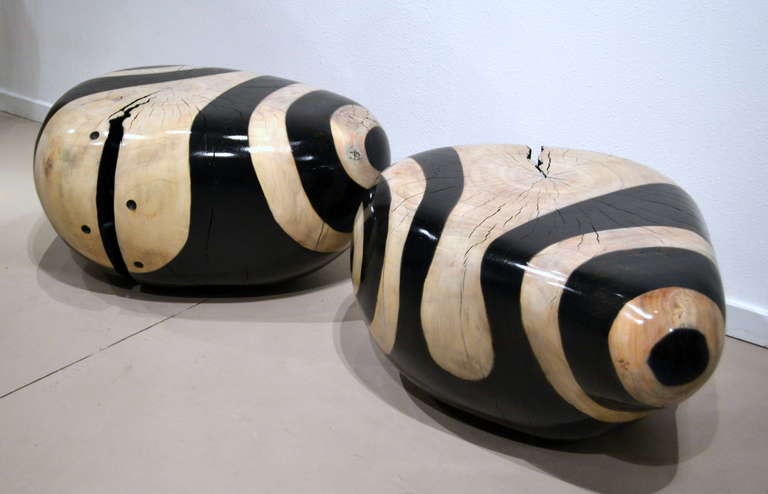 Daniel Pollock (b. 1952) continues to create unusual and much desired wood sculptural objects.  Here is a pair of black and white stained cottonwood seats in a similar pattern.  It all starts by taking re-claimed wood from the San Bernardino