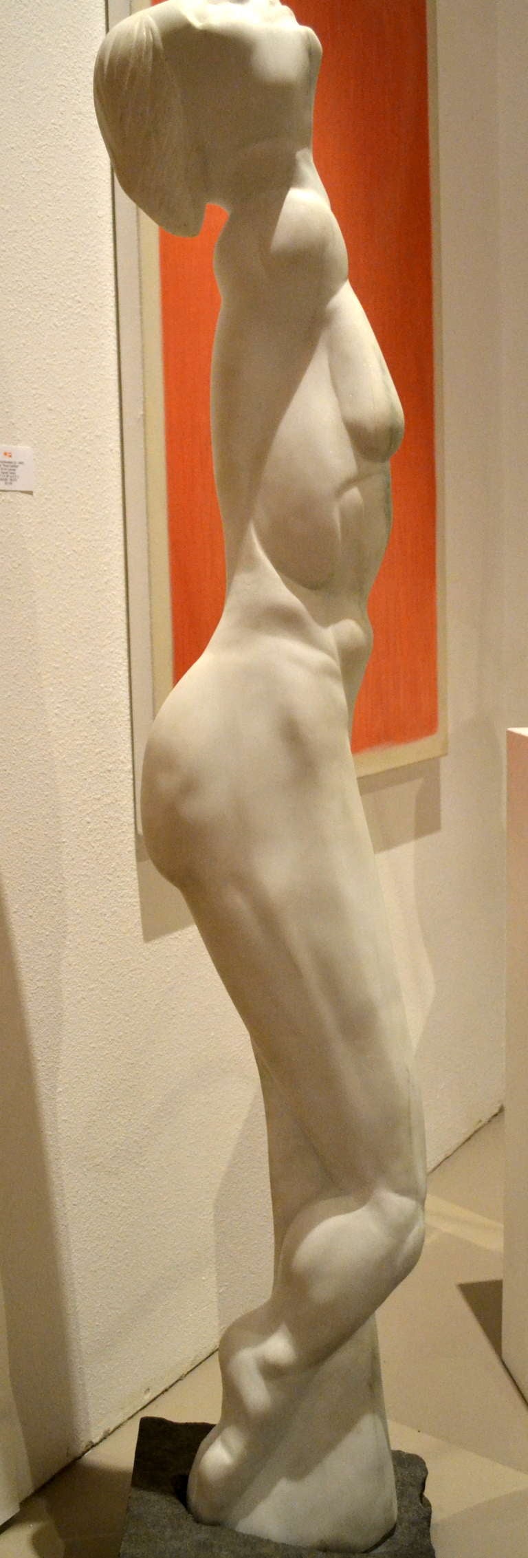 Hand-carved from one single piece of White Italian marble stands this lifesize abstract female figure. The sculpture stands effortlessly inside a separate block of granite which actually holds it in place.

Artist Scott Donadio (b.1961) should