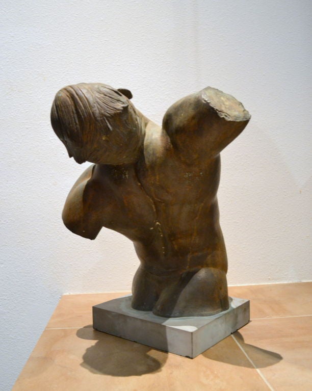 This male figure, sculpted in bronze and mounted to a black slate base, was executed in 1950 by the world-recognized and acclaimed artist, George Demetrios (1896–1974).  

Trained by Bourdelle, a student of Rodin, Demetrios studied at the Ecole