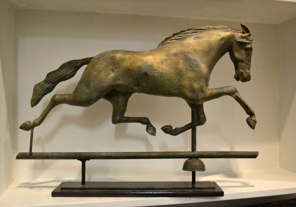 This handsome horse weathervane radiates history, age and beauty.  The horse in mid-gallop form, along with the oxidized and verdigris copper surface with hints of gold leaf running throughout, clearly makes this perfect for hanging on the wall,