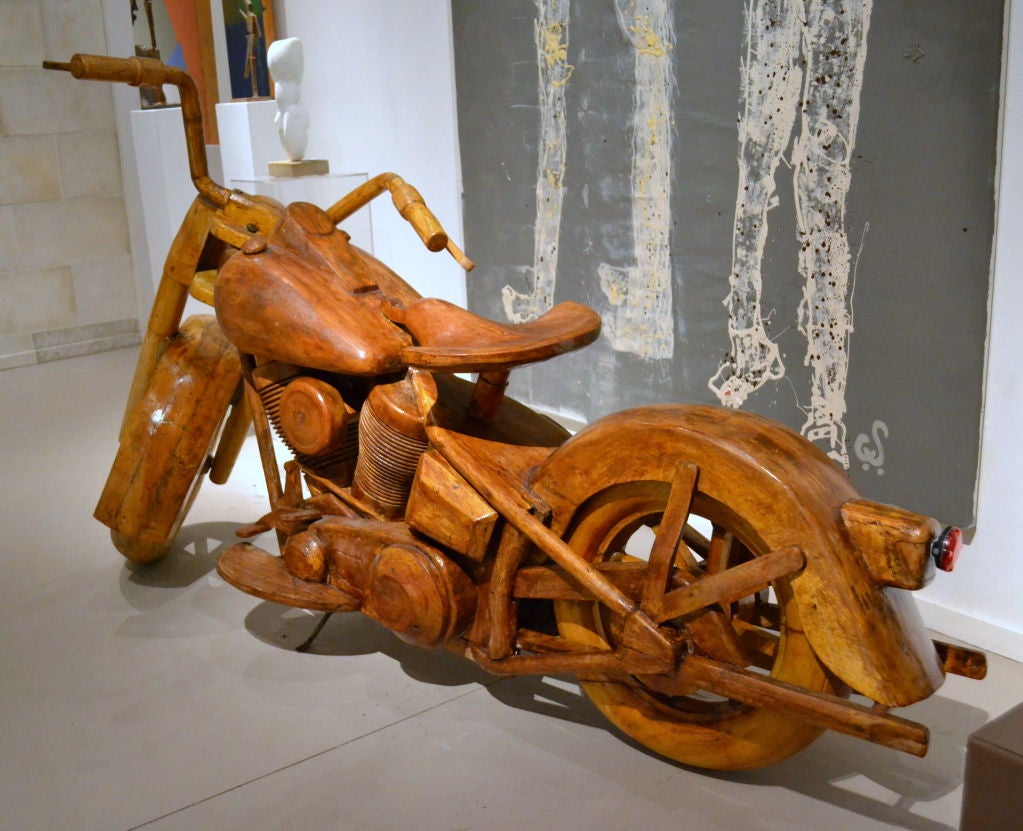 An absolute show stopper, no matter where it is parked.  Hand-carved wood, this full-scale 