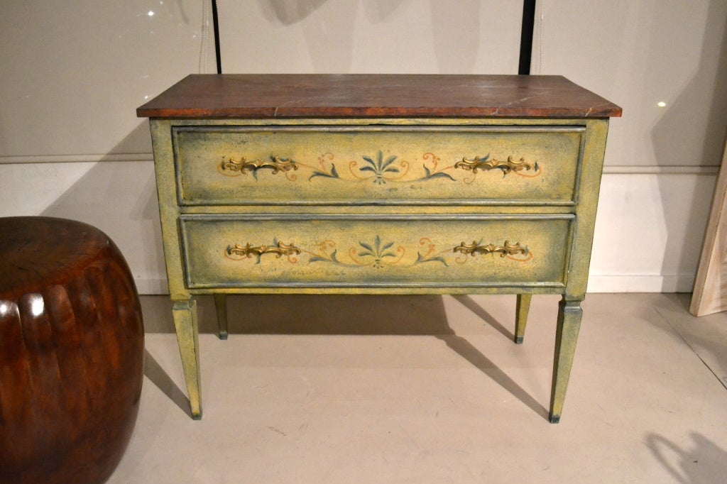This fine antique trompe l’oeil chest, circa 1890, with its original brass drawer handles, has been completely restored, including a newly painted faux marble top. 

This elegant chest came from the Palm Springs, California residence of Fredrick